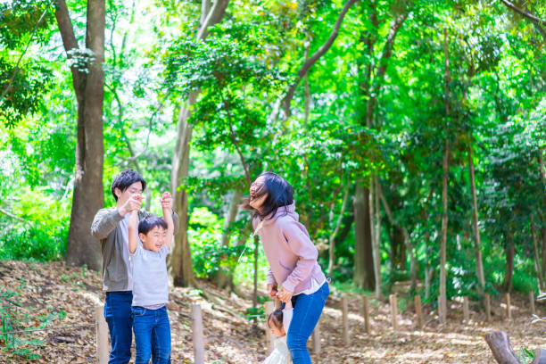 istock Family playing in the forest 1344759315