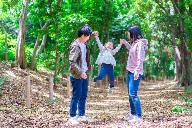 istock Family playing in the forest 1344759318