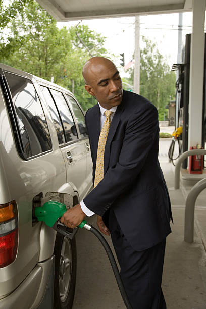 istock African American man pumping gas. 134475934