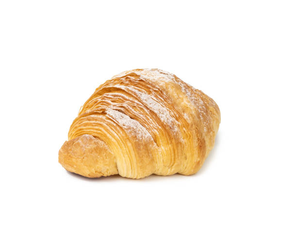 istock baked croissant isolated on white background and sprinkled with powdered sugar 1344759517