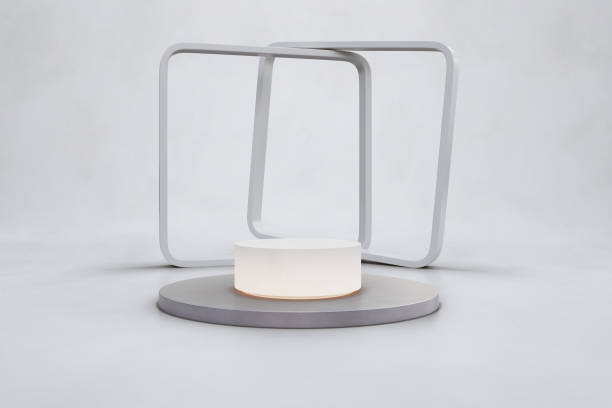 istock Round white podium on concrete floor and empty wall background. 1344760943