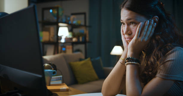 istock Confused woman staring at the computer screen 1344763708