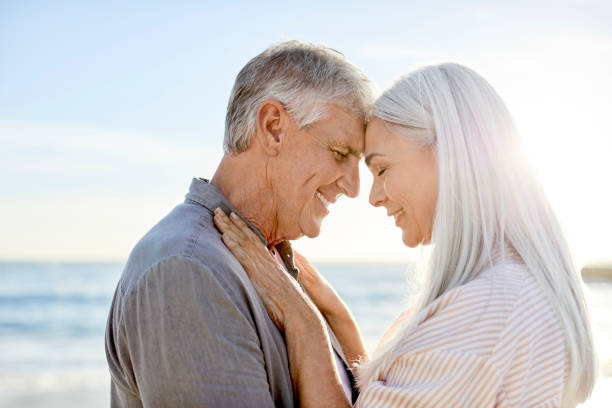 istock Romantic mature couple at beach 1344767769