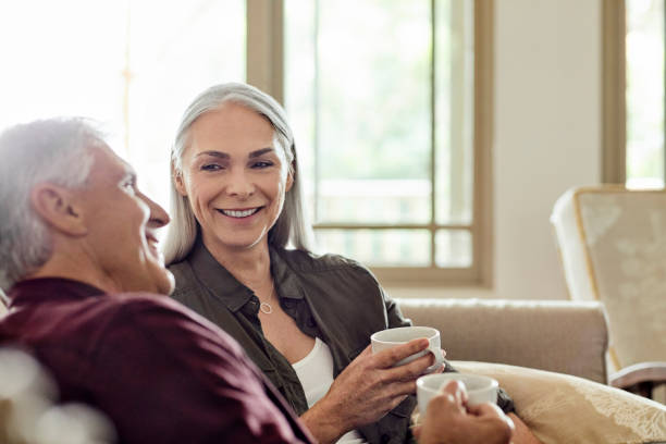 istock Happy couple having coffee at home 1344767926