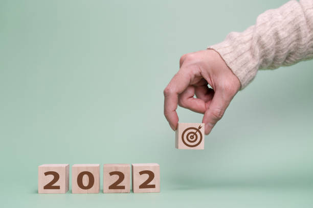 istock Hand choose target for 2022 year.  Planning for new year 1344768638