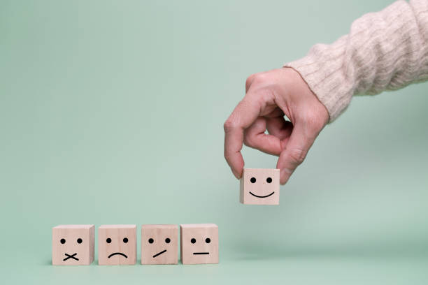 istock Customer hand choose a happy face.  Service, Survey, rate communication concept 1344768686
