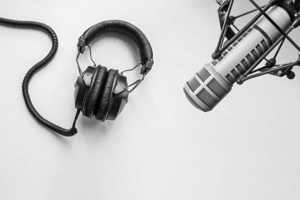 istock Background with a professional microphone and headphones 1344769687