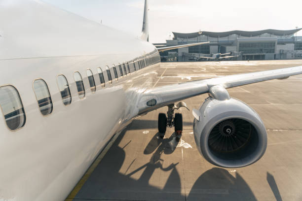 istock Close up of white plane on the runway 1344771325