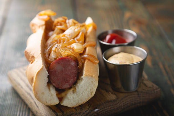 istock Hotdog with smoked sausage and fried onions 1344774480