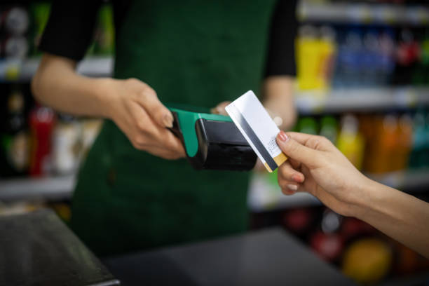 istock Make contactless payments with a credit card at the store 1344775599