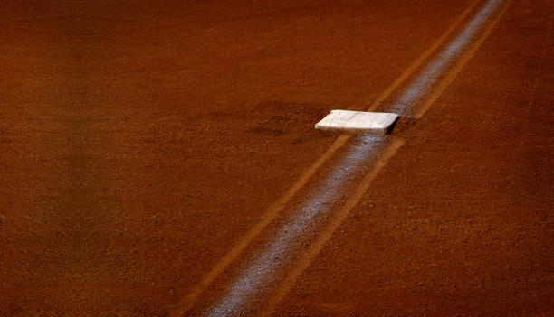 istock Baseball base and chalked base line in diamond 1344776507