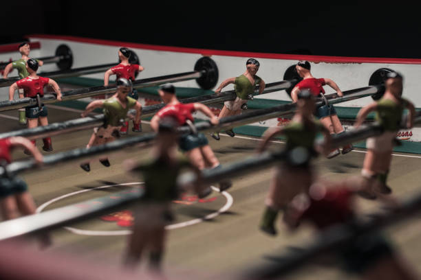 istock Foosball table game with red and green players 1344776894