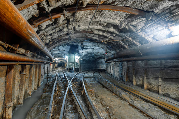 istock Underground mine. Underground railway for transporting ore. Mine trolley as part of an underground freight train 1344778100