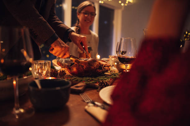 istock Family having Christmas dinner at home 1344778111