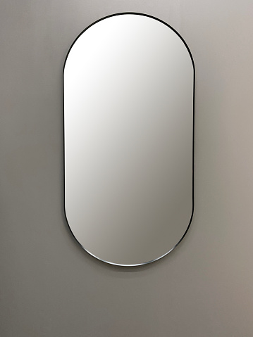 Front view full length mirror hanging on the wall (Frame with Clipping Path)
