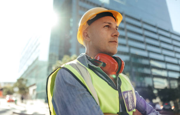 istock Blue collar worker looking thoughtful in the city 1344779746