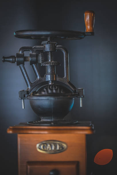 istock Vintage old coffee grinder with on dark background. 1344779767
