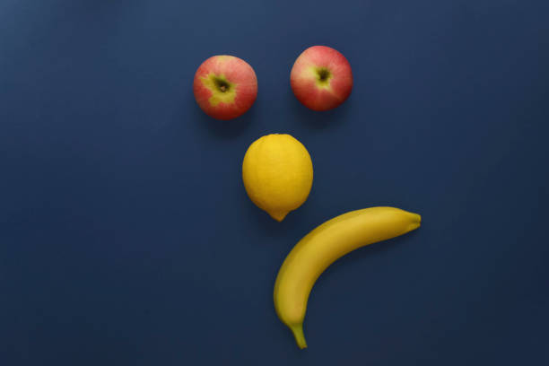 Sad smiley made from fresh ripe fruits top view. in Balashikha, Moscow Oblast, Russia