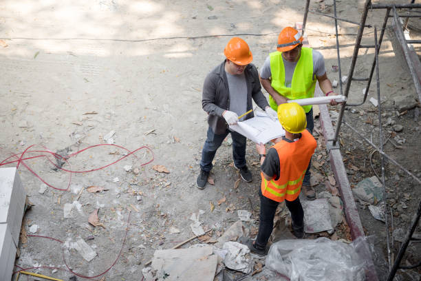istock Confident team of architect working together in building construction site. They discussing about new startup project. Architect discuss with engineer about project . Architectural concept. 1344782378