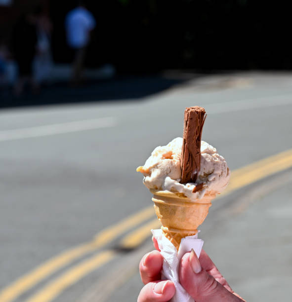 istock Ice cream cone being held in a serviette 1344786001