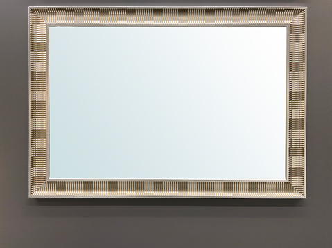 Front view mirror or picture frame (Clipping Path) hanging on the wall