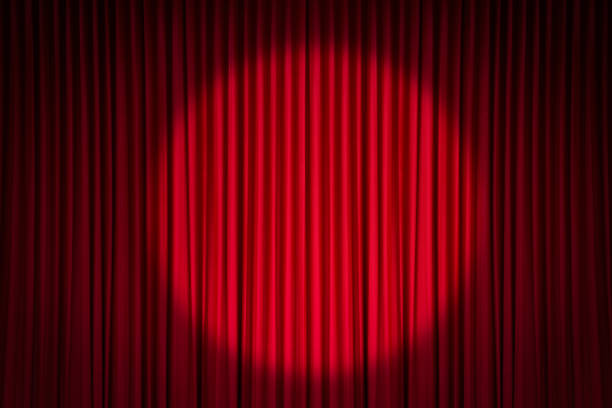 Red stage curtain Red stage curtain with spotlight curtain stock pictures, royalty-free photos & images