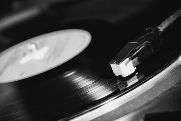 istock vinyl turntable needle on black record close up 1344788520