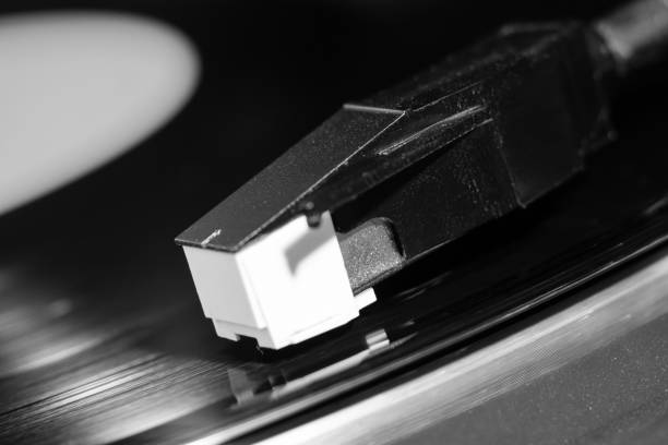 istock vinyl turntable needle on black record close up 1344788521