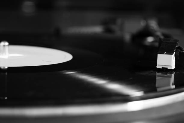 istock vinyl turntable needle on black record close up 1344788522