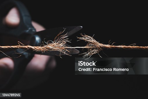 istock Cutting a rope 1344789245