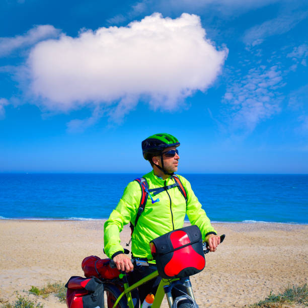 istock cycling tourist cyclist in Mediterranean beach 1344792762