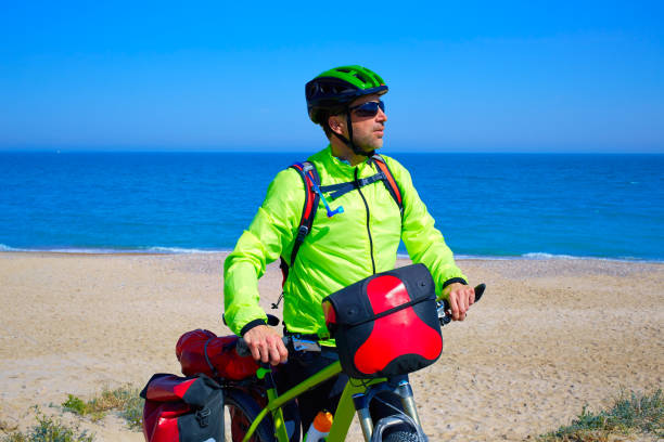 istock cycling tourist cyclist in Mediterranean beach 1344792783