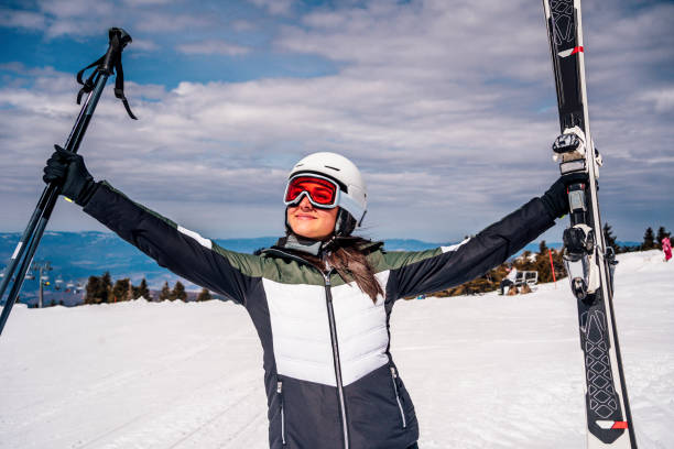 istock Young active woman skiing in mountains 1344797700