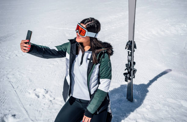 istock Woman skier taking selfie 1344798135