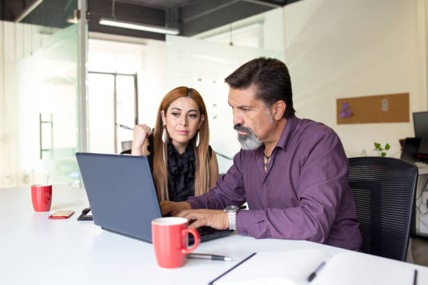 istock Man and woman working in the office 1344798291
