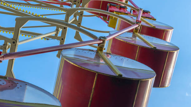 istock Ferris Wheel With Cabins.carousel against blue sky in a amusement park. 1344802082