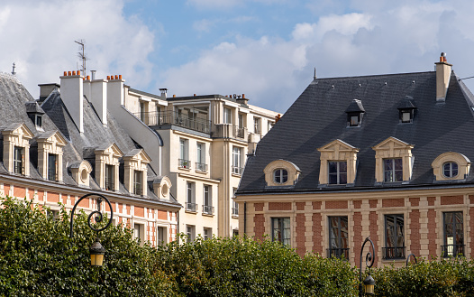 Paris, France, September 2021: Architecture at Place des Vosges in the Marais district