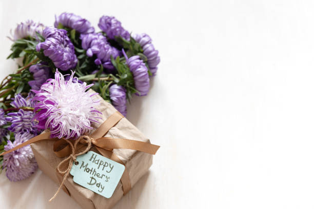 istock Gift box with a wish for a happy mother's day on a white background, copy space. 1344802836