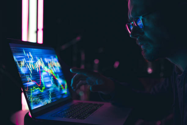 istock A man analyzing stock market charts, financial data on an electronic board. 1344803662
