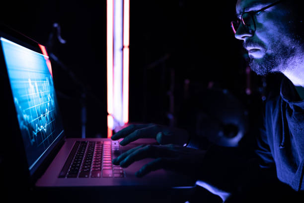 istock A man analyzing stock market charts, financial data on an electronic board. 1344803669