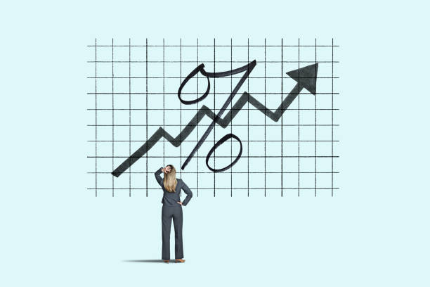 Woman Looks Up At Rising Interest Rates A woman looks up at an arrow and an interest rate symbol amidst as rates start to rise. rising interest rate stock pictures, royalty-free photos & images