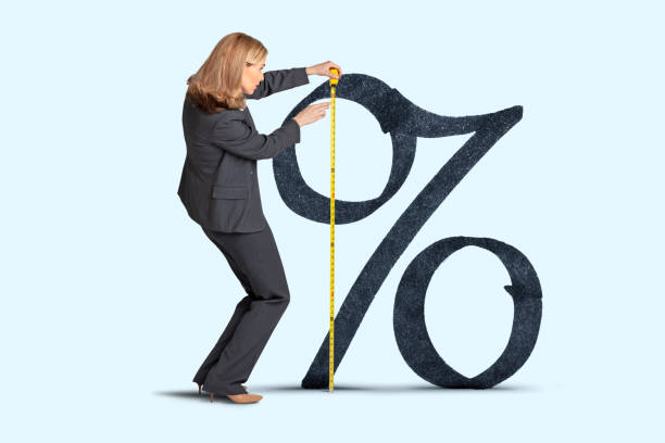 istock Woman Measuring Percent Sign 1344805546