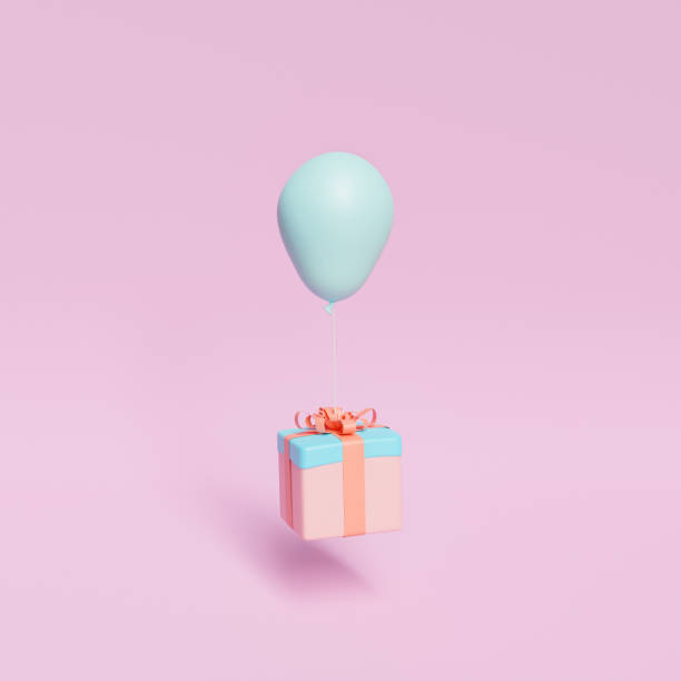 istock gift floating with a balloon tied 1344807474