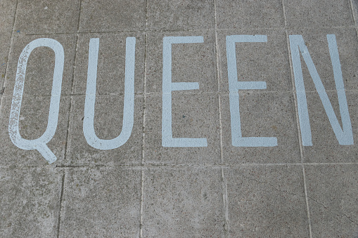 The name of the rockband or just a member of the royal family of England or Holland written on the floor on the walkway