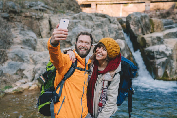 istock Couple on journey taking selfies 1344809499