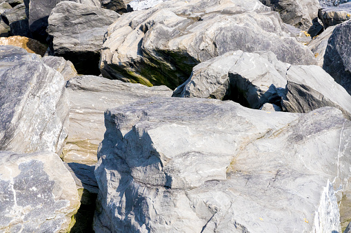 Large rocks on the sandy beach in norfolk