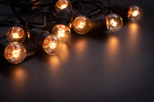 istock Vintage light bulb and dark space background 1344810610