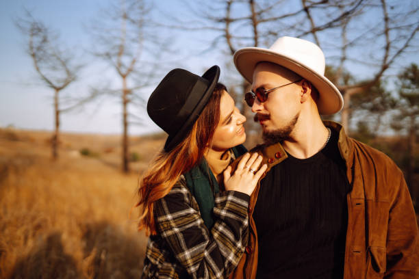 istock Young couple walking in the autumn park. 1344811261