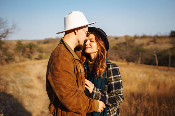 istock Young couple walking in the autumn park. 1344811262