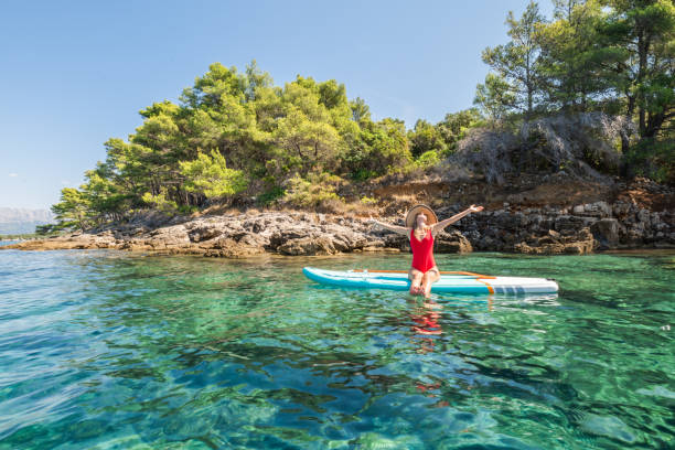 istock Woman on stand up paddle in Croatia 1344811680